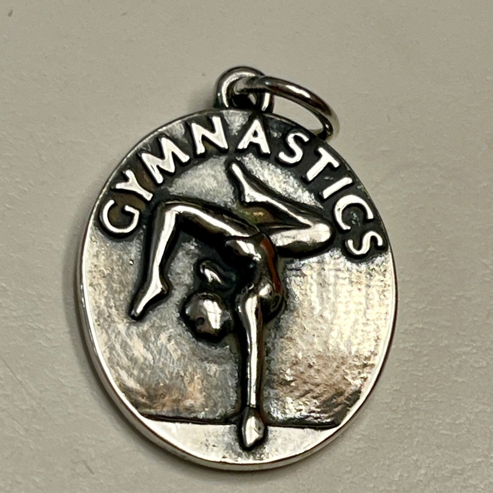 Gymnastics pendant- retired James Avery